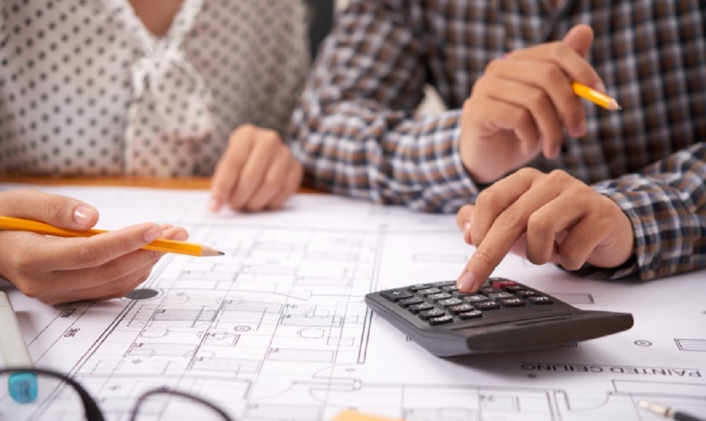 A couple calculating their construction expenses